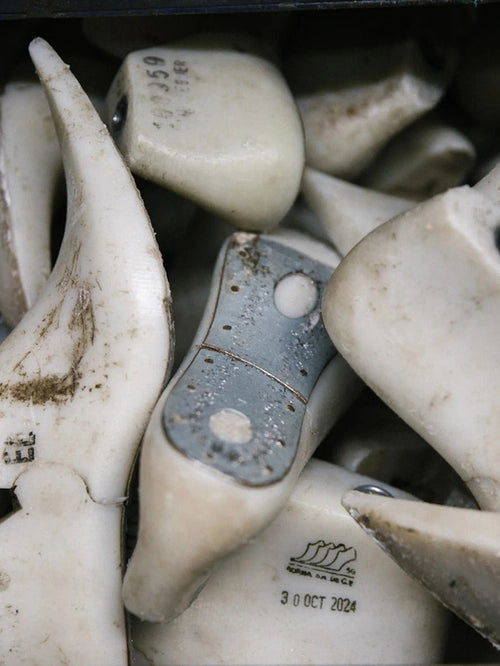 White boot lasts piled up in the workshop